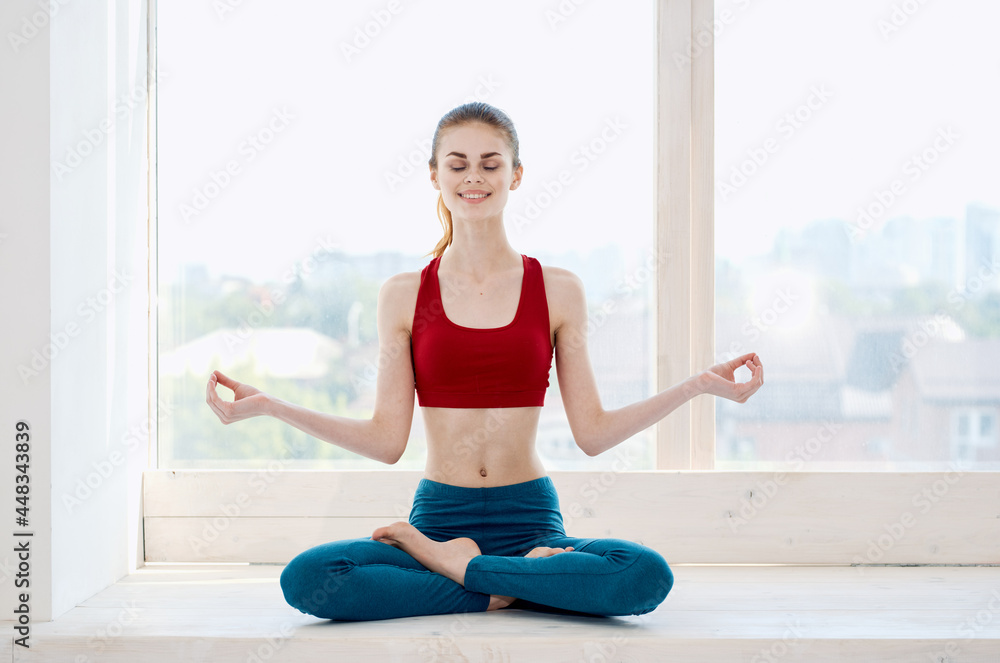 woman near window yoga exercise meditation relaxation