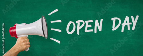 A man holding a megaphone - Open day