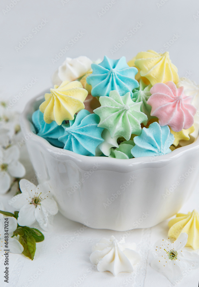 Small colorful meringues in the ceramic bowl Small colorful meringues in the ceramic bowl