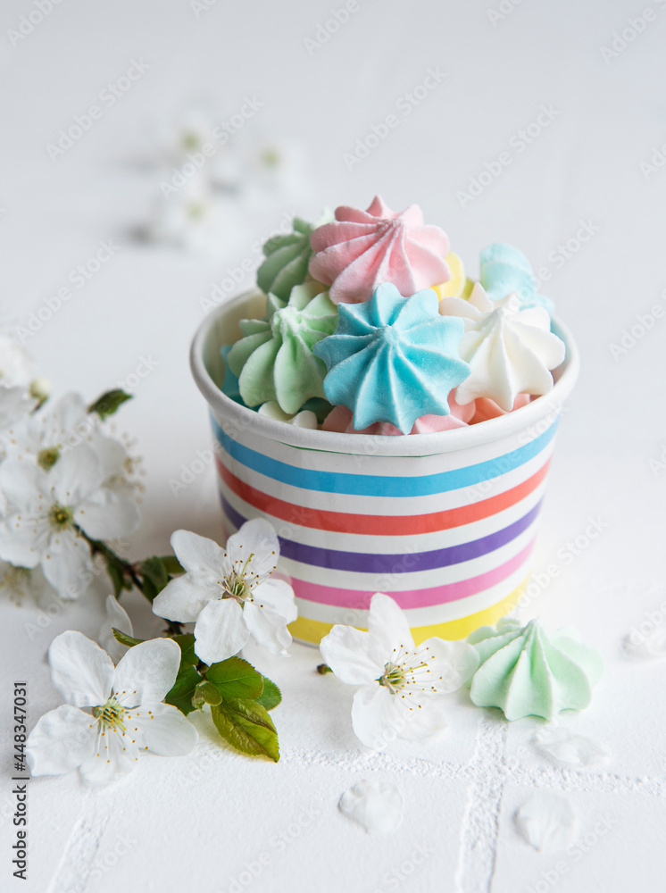 Small colorful meringues in the paper bowl Small colorful meringues in the paper bowl