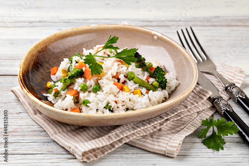 Bowl with tasty rice and vegetables