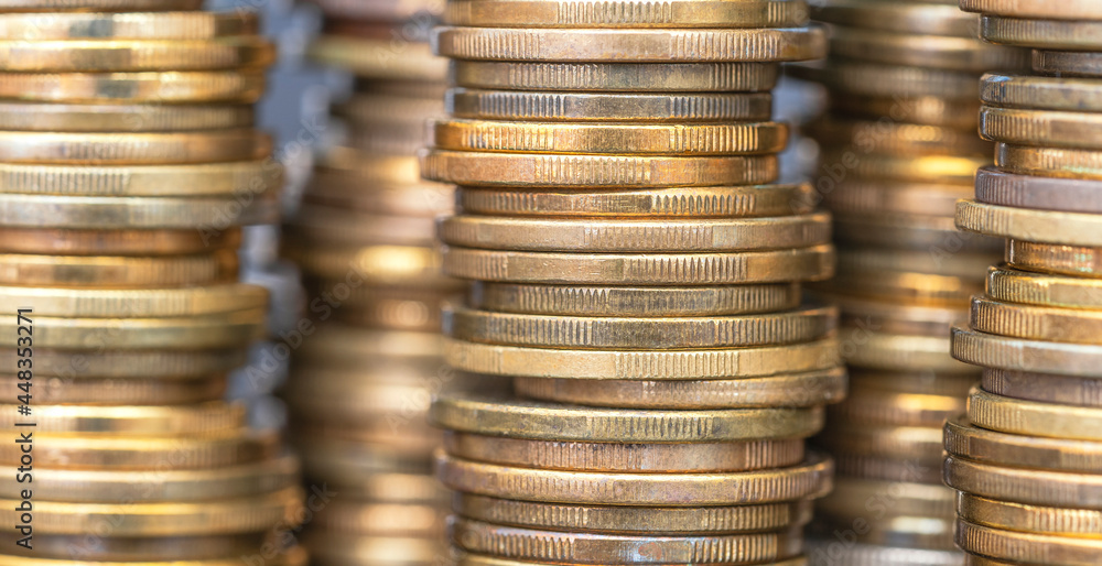 Macro close up coins arranged in height on a blurred background Macro close up coins arranged in height on a blurred background