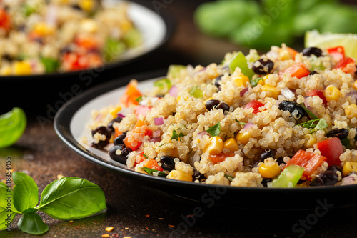 Quinoa black bean salad with corn, red green pepper, onion. Healthy food.