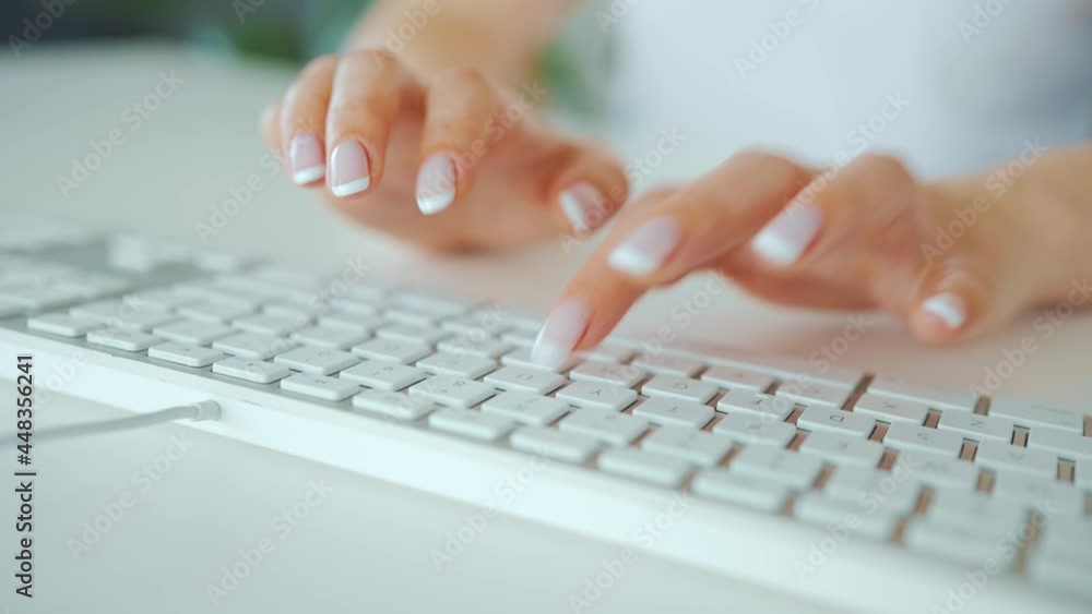 Female hands typing on a computer keyboard. Concept of remote work. Female hands typing on a computer keyboard. Concept of remote work.