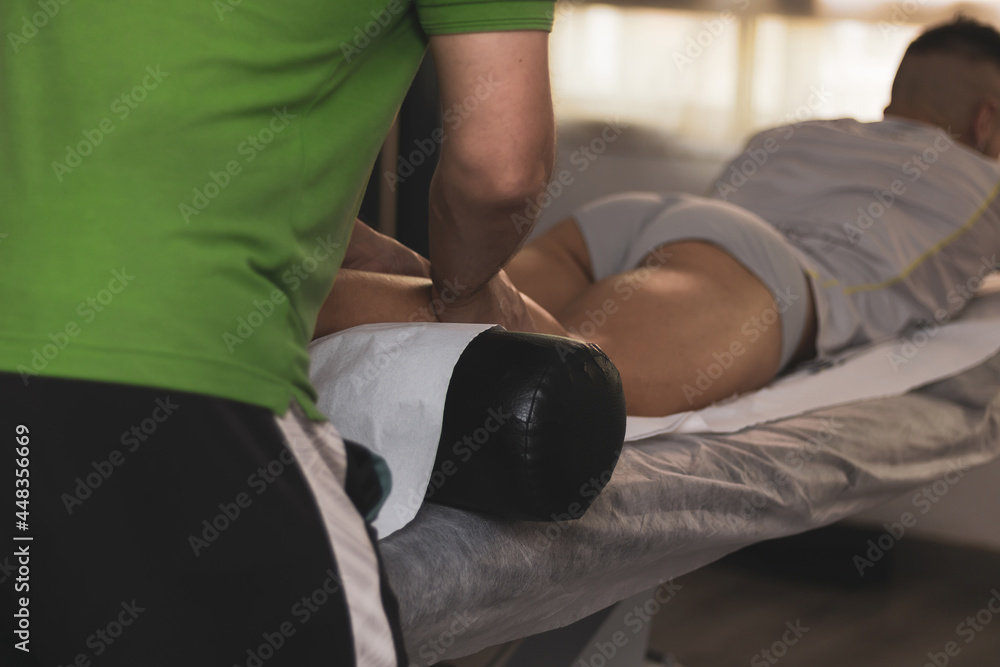 Naklejka premium a physical therapist working in your practice.