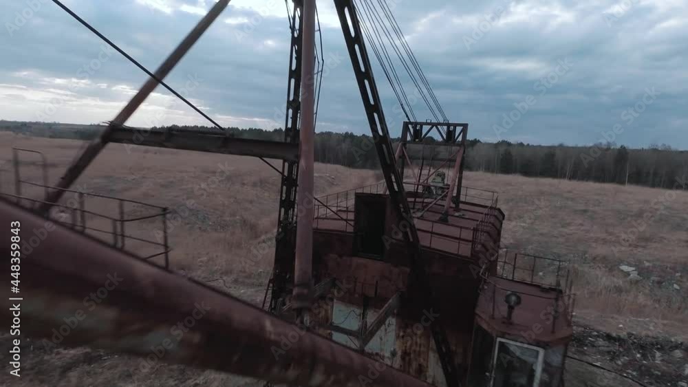 FPV drone flies smoothly near rusty abandoned walking excavator FPV drone flies smoothly near rusty abandoned walking excavator