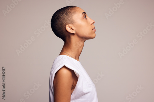 Androgynous woman with shaved head