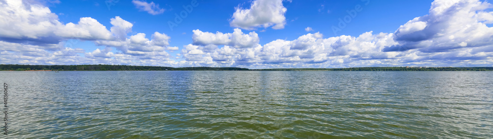 Beautiful natural summer landscape with picturesque lake Senezh and cloudy sky. Moscow region, Russia 