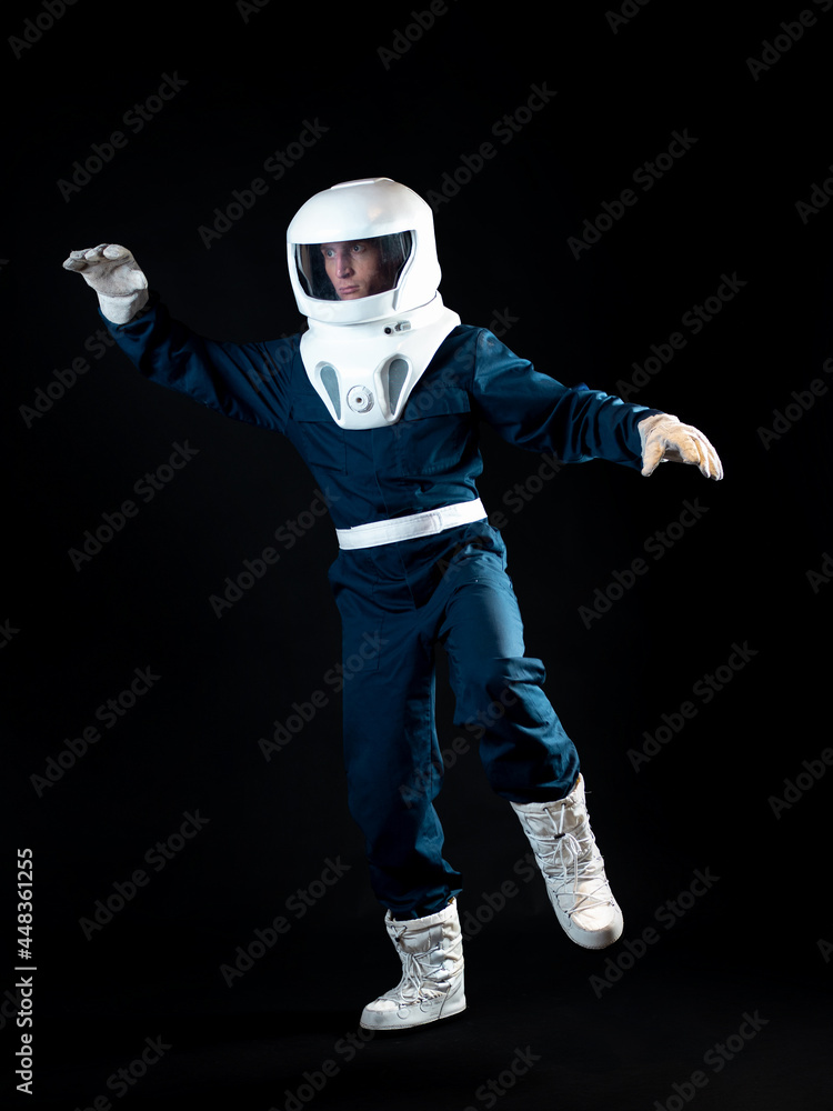 The astronaut is floating in weightlessness. The hero The astronaut is floating in weightlessness. The hero