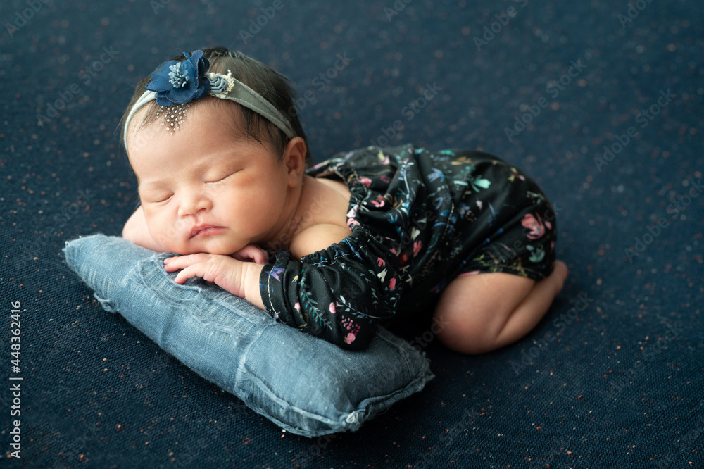 Cute baby in blue dress lying on the blue blanket. Cute baby in blue dress lying on the blue blanket.