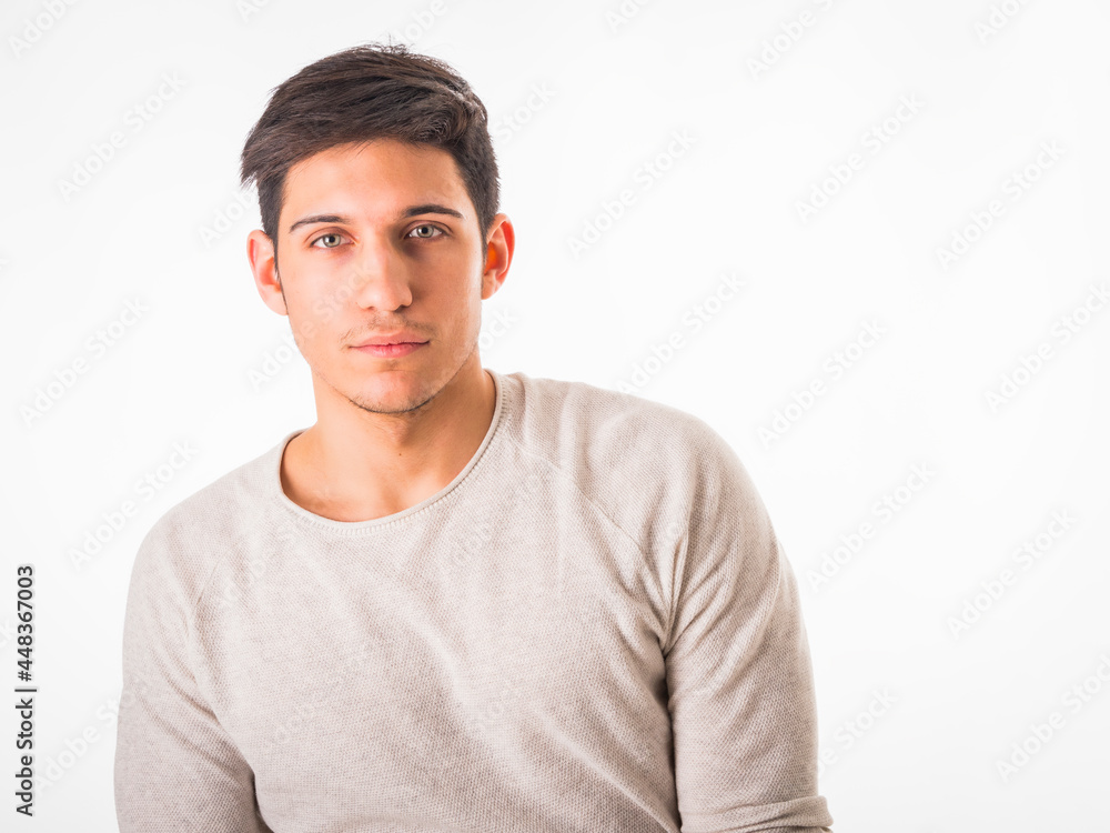 Fit handsome young man standing confident in casual clothes isolated on white Fit handsome young man standing confident in casual clothes isolated on white