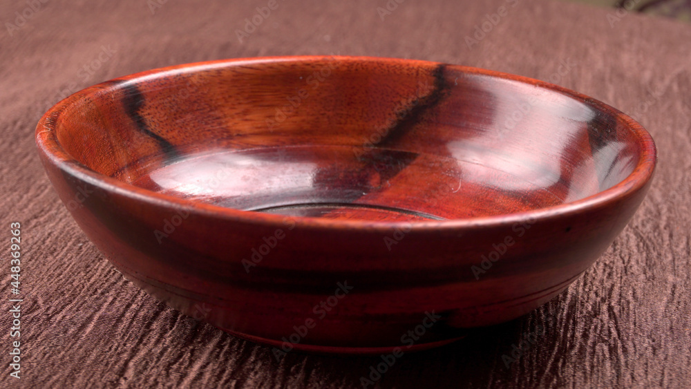 Empty wooden bowl and wooden spoon isolated with copy space. Empty wooden bowl and wooden spoon isolated with copy space.