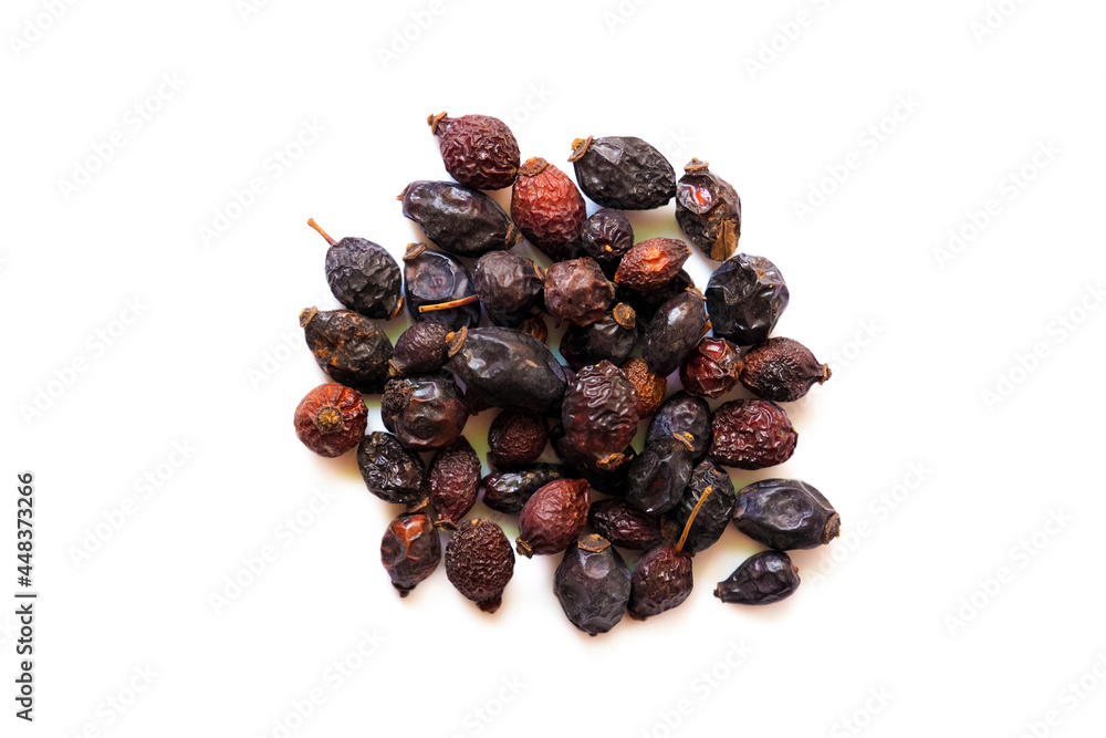 Obraz premium Pile of dried rose hips isolated on white background, top view. Pile of dried rose hips. Rosa cinnamomea, briar