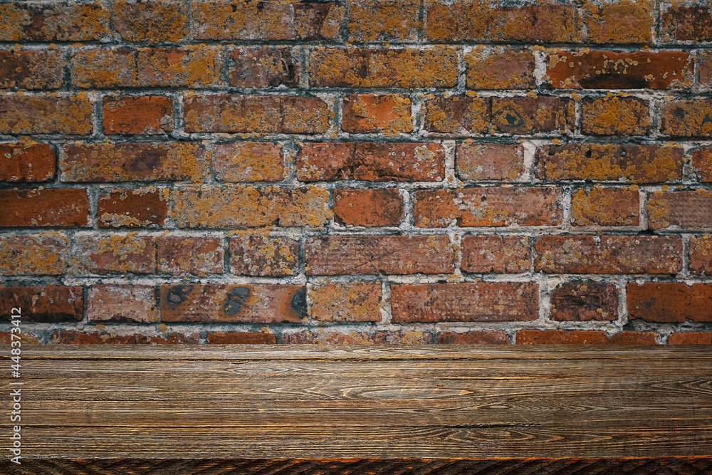 The background is blank wooden boards and a textured brick wall with lighting and vignetting. The background is blank wooden boards and a textured brick wall with lighting and vignetting.