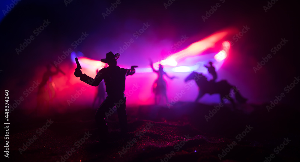 Western cowboy silhouette with texture at sunset and slivers of light Western cowboy silhouette with texture at sunset and slivers of light