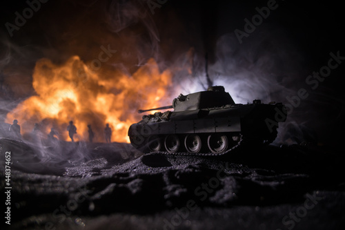 War Concept. Military silhouettes fighting scene on war fog sky background, World War Soldiers Silhouette Below Cloudy Skyline At night. Battle in ruined city. Selective focus