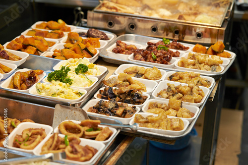 Various side dishes displayed in a traditional market 