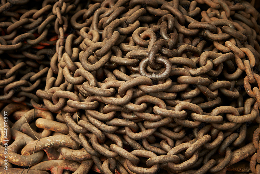 Rusty chains and locks inside an old factory Rusty chains and locks inside an old factory