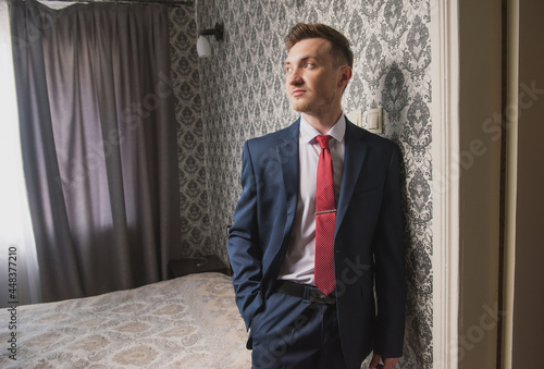 Portrait of the groom who dresses before meeting the bride