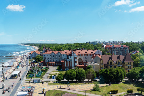 The coast of the city of Zelenogradsk with a view of the embankment, houses and pier, top view.