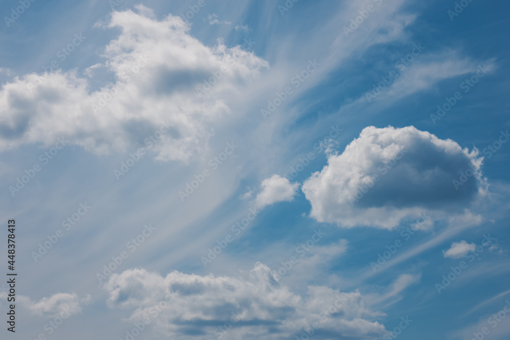 Blue sky with fluffy white clouds. Natural background.
Blue sky with fluffy white clouds. Natural background.