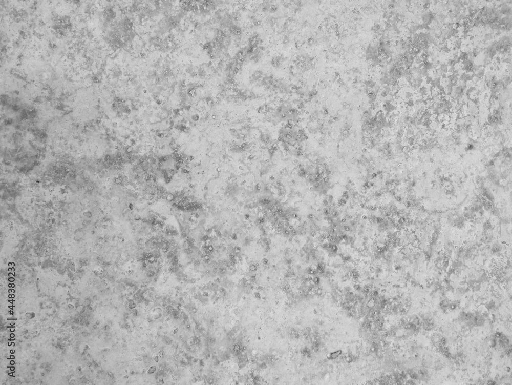 Obraz premium Black and white background, rough texture, looks like a cement floor for background or advertising text.