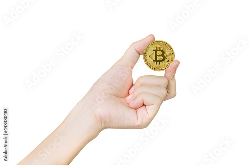 Close up of businesswoman holding some pieces of golden Bitcoin token