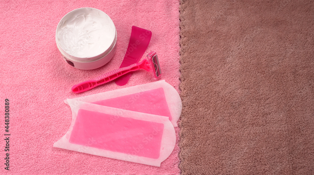 Set of different means for epilation on a colored background. Removal of unwanted hair. Modern epilator, wax strips, razor. Set of different means for epilation on a colored background. Removal of unwanted hair. Modern epilator, wax strips, razor.