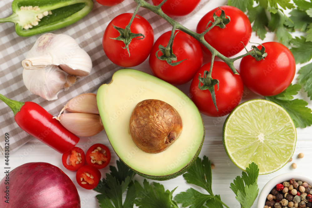 Fresh ingredients for guacamole on white wooden table, flat lay Fresh ingredients for guacamole on white wooden table, flat lay