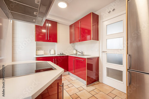Dark red kitchen with small vintage appliances in vacation rental apartment