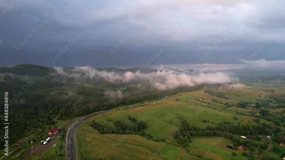 Aerial view on serpentine road in mountains at sunset amazing blue sky with clouds nature landscape. Mountain Range Silhouette Sunrise Drone View. Aerial view on serpentine road in mountains at sunset amazing blue sky with clouds nature landscape. Mountain Range Silhouette Sunrise Drone View.