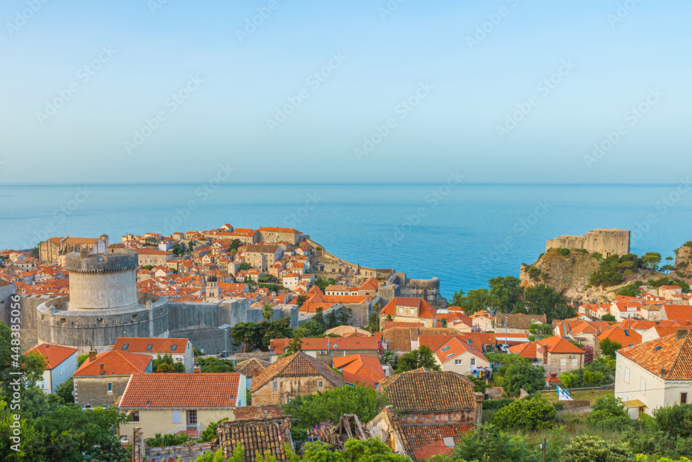 Aerial view of the old town of Dubrovnik, Croatia with rooftops, city walls, fort Lovrijenac and Adriatic sea