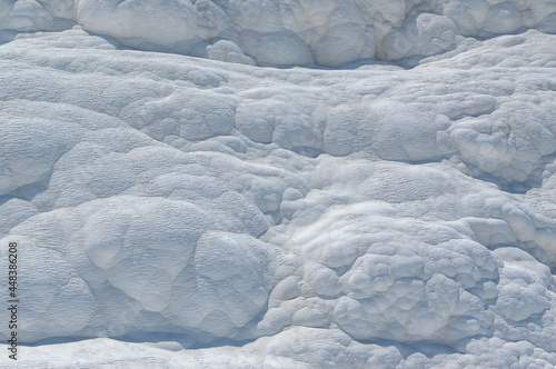 Pamukkale travertine texture. Wavy limestone textured deposits on terraces of carbonate minerals in Pamukkale, Turkey