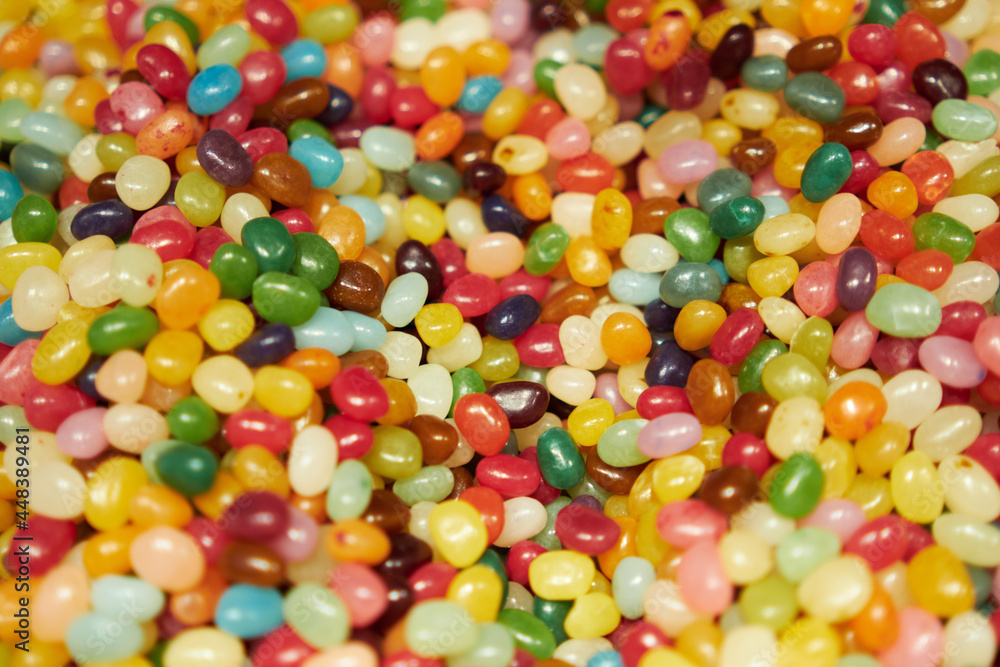Mixed multi-colored jelly beans . Mixed multi-colored jelly beans .