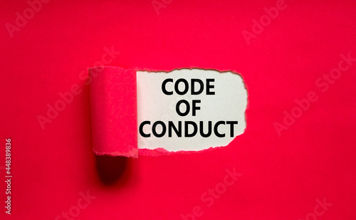 Code of conduct symbol. Words 'Code of conduct' appearing behind torn purple paper. Beautiful purple background. Business, code of conduct concept, copy space.