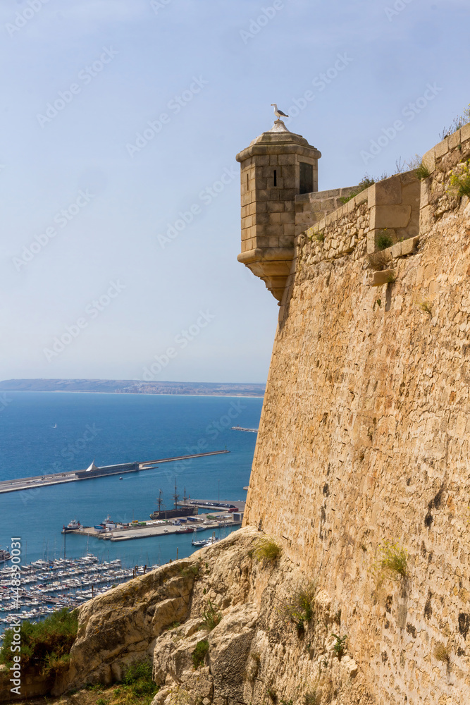 Detail of the Castle of Alicante before the port in the sea 