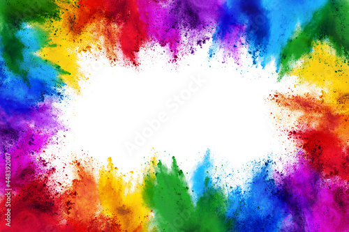 frame border with copy space of colorful rainbow holi paint color powder explosion isolated white background © stockphoto-graf