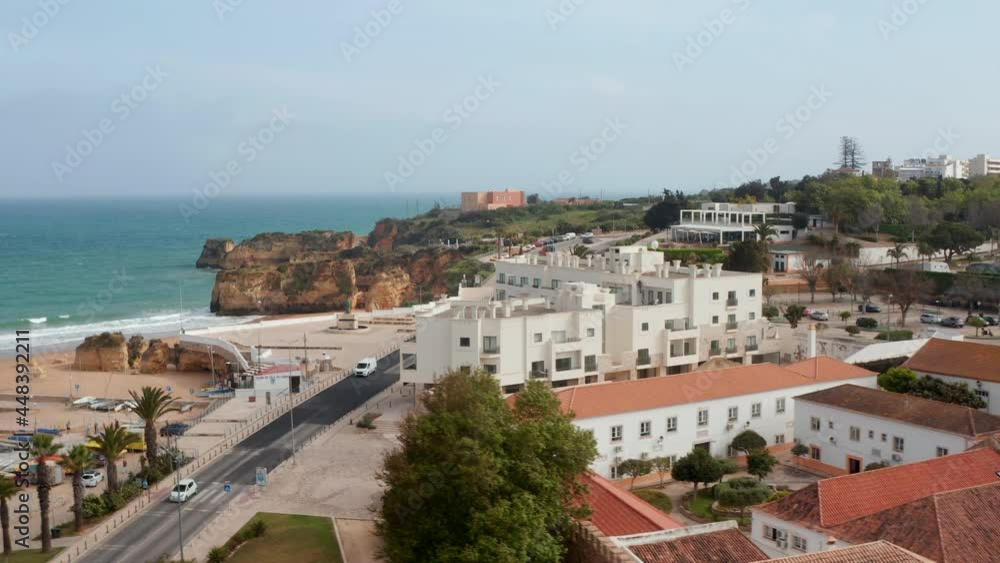 Sideway aerial drone view of Lagos city close to sensational coastline beach, Portugal, day Sideway aerial drone view of Lagos city close to sensational coastline beach, Portugal, day