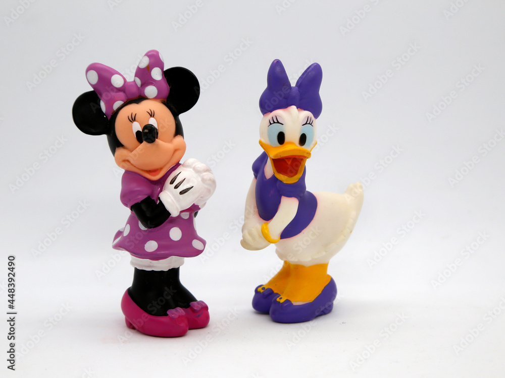 Minnie Mouse and Daisy Duck. Toys. Cartoons characters from Walt Disney  Pictures Studios. Minnie is Mickey Mouse's girlfriend. Daisy is Donald  Duck's girlfriend. Isolated white. Stock Photo | Adobe Stock
