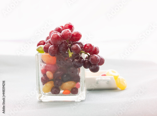 Group of Grape with waterdrops put on candies glass,