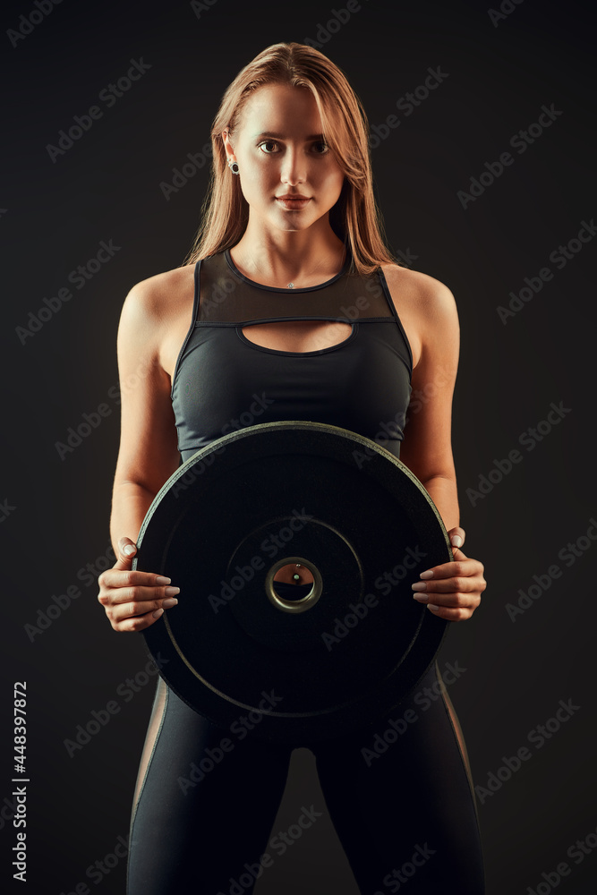 sportive girl with iron disk