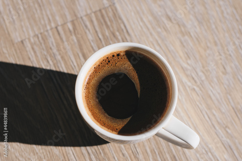 cup of coffee on wooden table