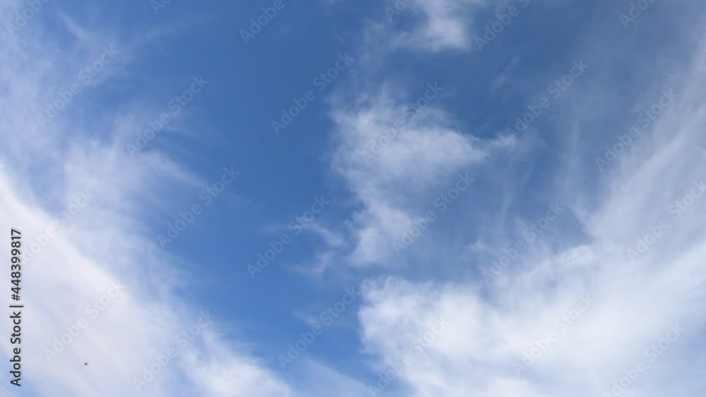 Thin cirrus clouds in the blue sky, time-lapse. Cloudy sky video.
Thin cirrus clouds in the blue sky, time-lapse. Cloudy sky video.