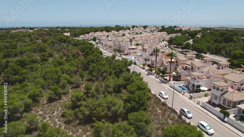 Drone point of view Pinar de Campoverde with residential luxury wealthy villas at sunny summer day, southern Spain. Modern homes, new real-estate property concept photo