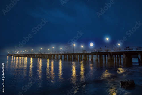Night view of the moonlit night and the pier in Gdynia, Poland
