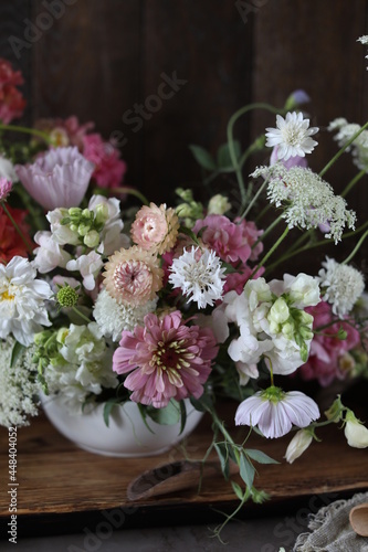Floral arrangement of summer garden flowers in pastel shades on the table. English floristry. Still life. © Susie Foods