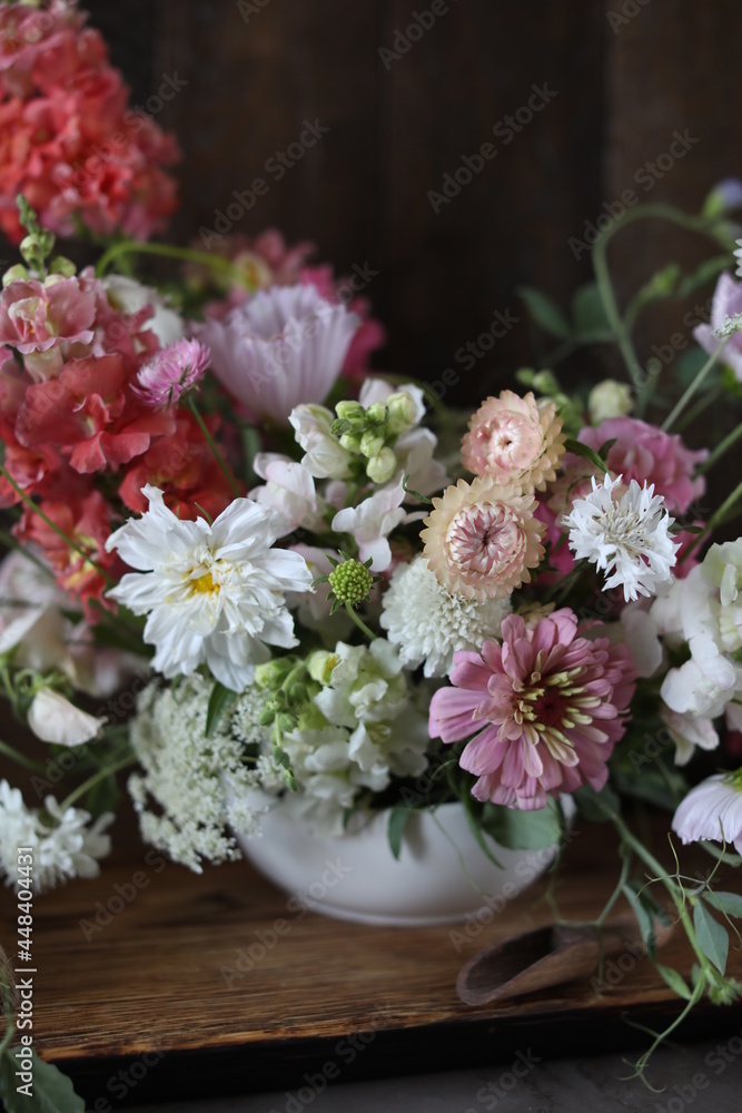 Floral arrangement of summer garden flowers in pastel shades on the table. English floristry. Still life. Floral arrangement of summer garden flowers in pastel shades on the table. English floristry. Still life.