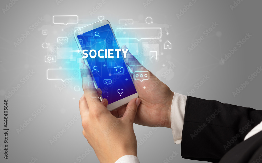Hand using smartphone with social media concept Hand using smartphone with social media concept