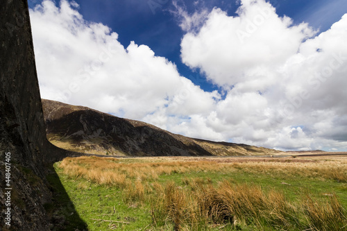 View of a curved section of the remaining Llyn Eigiau Dam with Moel Emilio behind, Snowdonia, North Wales photo