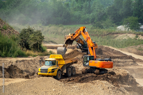 Dump truck and excavator at work